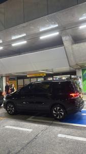 a black limo parked in a parking garage at Wallace in São Paulo