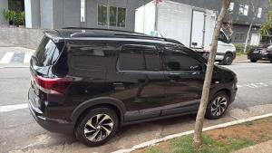 a black suv parked on the side of a street at Wallace in São Paulo