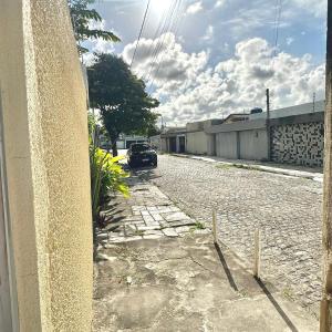 a car parked on the side of a street at Anexo Térreo - Pousada Cannã in Recife