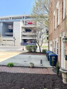 a cat sitting on a sidewalk next to a building at Downtown house w On-site Parking Walk to Capital, Museums B in Washington, D.C. +16 photos