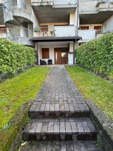 a brick walkway in front of a building at Volpes home in Desenzano del Garda +11 photos