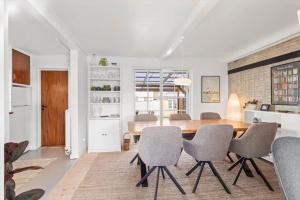 a kitchen and dining room with a table and chairs at AE324-Marstal-Kirkestraede-31 in Marstal