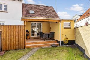 a house with a wooden deck in the backyard at AE324-Marstal-Kirkestraede-31 in Marstal +16 photos