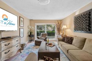 a living room with a couch and a tv at 803 Clipper Court in Hilton Head Island