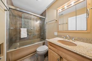 a bathroom with a sink and a shower and a toilet at 803 Clipper Court in Hilton Head Island +40 photos