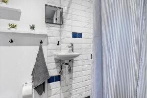 a white bathroom with a sink and a mirror at 2010-Romo-Moritzvej-10 in Høm +30 photos