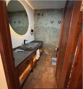 a bathroom with a sink and a mirror at Hotel Boutique Santa Teresa in Tlazcalancingo