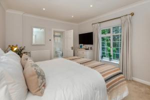 a bedroom with a white bed and a window at 4 Bed in Bray oc-b32610 in Bray +33 photos
