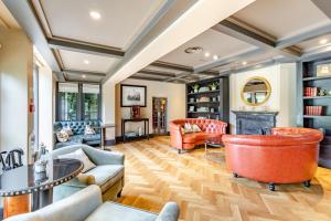 a living room with furniture and a fireplace at 4 Bed in Bray oc-b32610 in Bray