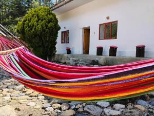 a hammock in front of a house at Casa I Love Huaraz in Huaraz