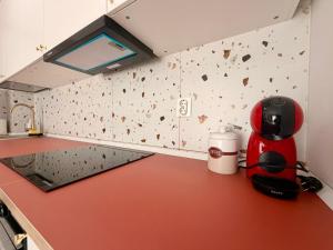 a kitchen with a coffee maker on a counter at Damon Suite #NorthBucharest in Tunari +4 photos