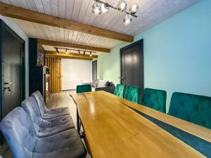 a conference room with a wooden table and chairs at Шале in Krivopolʼye +45 photos