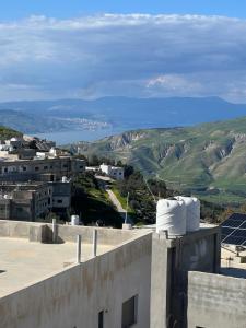 a view of a city from the roof of a building at Altamem apartment in Um Qeis