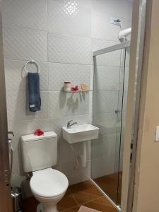 a bathroom with a toilet and a sink at Flat Yellowtuna in Fernando de Noronha