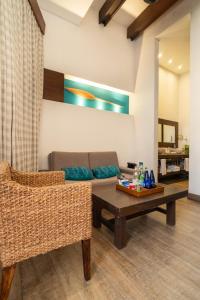 a living room with a couch and a table at Sophia Hotel By OxoHotel in Cartagena de Indias