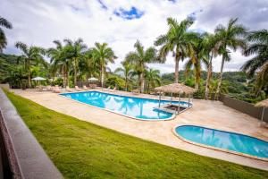 an image of a swimming pool at a resort at Hotel Vista Alegre in Barranquitas