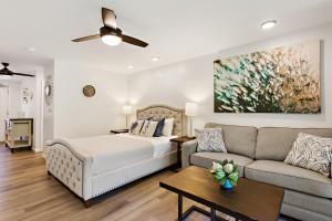 a living room with a bed and a couch at Napili Puamala 128 in Kahana