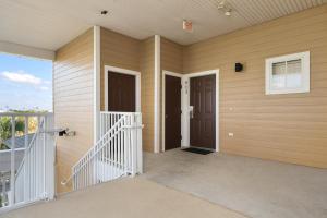 a house with two doors and a balcony at Bahama Bay Huge Penthouse condo in Kissimmee