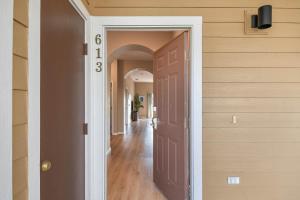 a hallway of a home with a brown door at Bahama Bay Huge Penthouse condo in Kissimmee