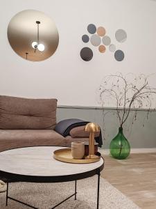 a living room with a couch and a coffee table at U prolazu in Đakovo
