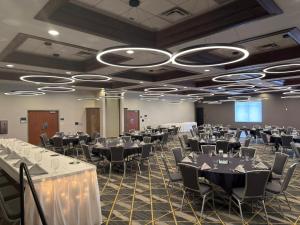 a banquet hall with tables and chairs in a room at Holiday Inn Midland by IHG in Midland +71 photos