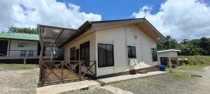a small house with a lot of windows at Casa el Corral #2 in Aguacate