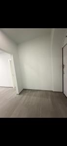 an empty room with white walls and a wooden floor at Dzor house in Yerevan