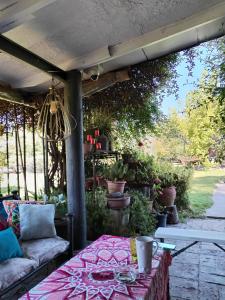 an outdoor patio with a couch and a table at Casa Refugio Relajante in Pirque