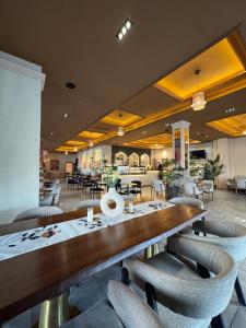 a dining room with a long table and chairs at Sorelle Hotel in Prizren +28 photos