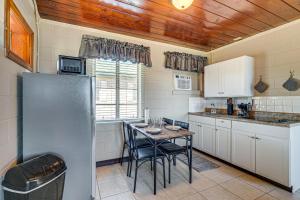 a kitchen with a table with chairs and a refrigerator at Lake View, Pool Access! Pet-Friendly Hernando Stay in Hernando
