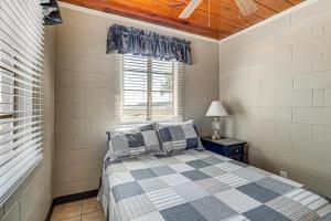 a bedroom with a bed and a window at Lake View, Pool Access! Pet-Friendly Hernando Stay in Hernando +17 photos