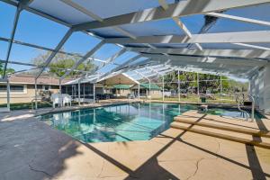 a large swimming pool with a glass roof at Lake View, Pool Access! Pet-Friendly Hernando Stay in Hernando