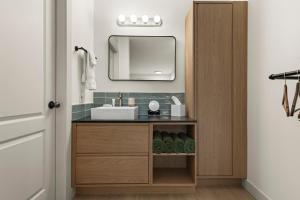 a bathroom with a sink and a mirror at Lakeside Villa & Nordic Spa in Penticton +90 photos