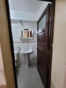 a bathroom with a sink and a toilet at Tia Clara in San Salvador de Jujuy