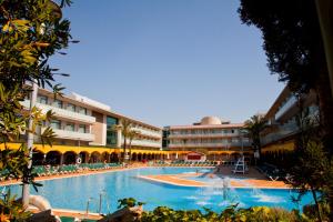 a large swimming pool in front of a hotel at Hotel Mediterraneo in Benidorm