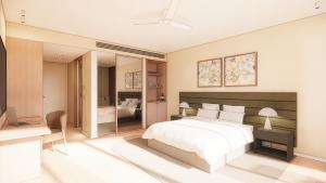 a bedroom with a bed and a desk and a television at Reflections at Rich River in Moama