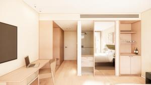 a room with a desk and a room with a bed at Reflections at Rich River in Moama