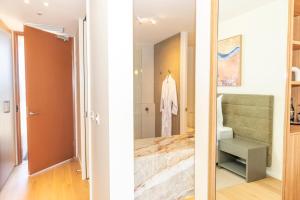 a bathroom with a sink and a toilet in a room at Reflections at Rich River in Moama