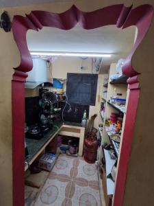 a room with a desk and a computer in it at MSVNATIVE HOME Stay Near Airport in Chennai +4 photos