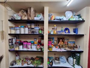 a pantry filled with lots of items on shelves at MSVNATIVE HOME Stay Near Airport in Chennai