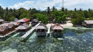 an aerial view of a resort in the water at Adefiro homestay in Waisai +9 photos