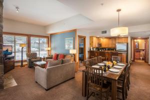 a living room with a couch and a table at Legends Whistler, by Lodging Ovations in Whistler