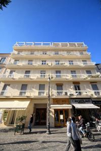 a large white building with people walking in front of it at Panoramic Apartment Sea & Vesuvio View, Sorrento Center, COSTA DEL SOLE in Sorrento