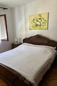 a bedroom with a large bed with white sheets at Apartments with parking space Vis - 2436 in Vis