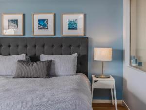 a bedroom with a bed and a table with a lamp at Salt Beach Resort Apartments by Kingscliff Accommodation in Kingscliff