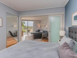 a bedroom with a bed and a living room at Salt Beach Resort Apartments by Kingscliff Accommodation in Kingscliff +15 photos