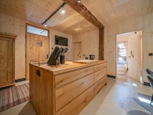 a kitchen with a wooden counter in a cabin at Raneburg 4 in Matrei in Osttirol