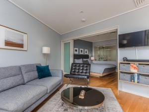 a living room with a couch and a bed at Salt Beach Resort Apartments by Kingscliff Accommodation in Kingscliff