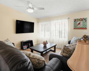 a living room with a couch and a table at Home Field Hideaway in Pullman