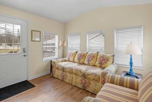 a living room with a couch and a window at Home Field Hideaway in Pullman +24 photos